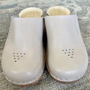 Wooden clogs. Wooden sole and leather upper.